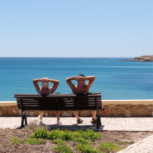 Travel photograph of an elderly couple sunbathing