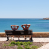 Travel photograph of an elderly couple sunbathing