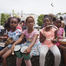 Little girls playing music at Heeswijkplein, The Hague