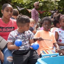 Little boys playing music at Heeswijkplein, The Hague