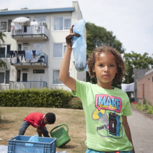 Portrait of a boy making a flower bomb in Moerwijk, The Hague