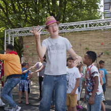 Mentally disabled man with colourful hat having fun on a podium in Moerwijk, The Hague