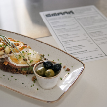 Bread with warm goat cheese and a menu