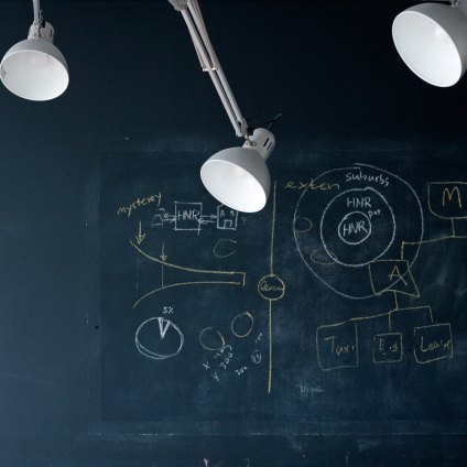 Interior photo of a black board and lamps