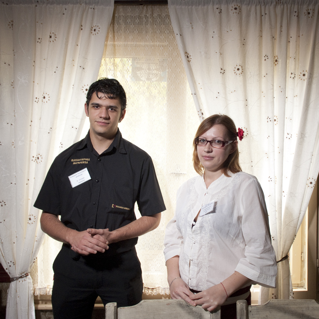 A portrait of two waiters in a restaurant in Sofia